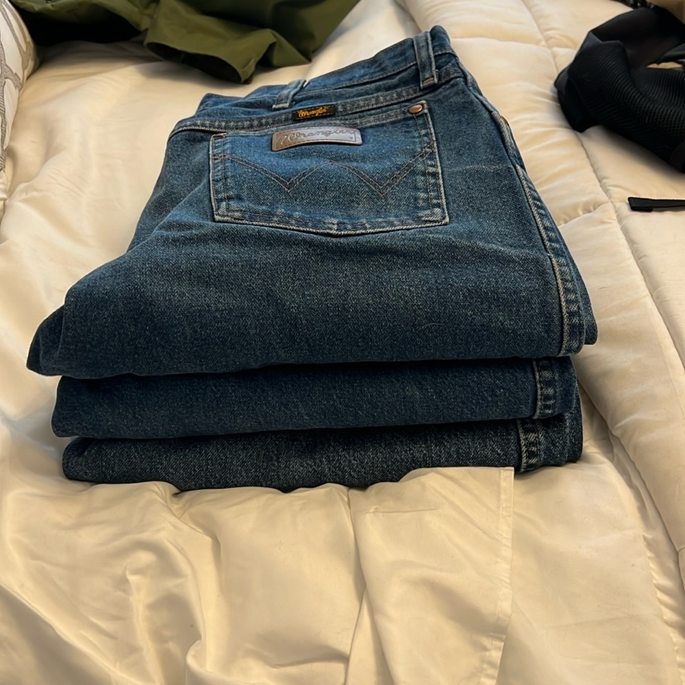 3 pair of worn in wranglers jeans straight leg.